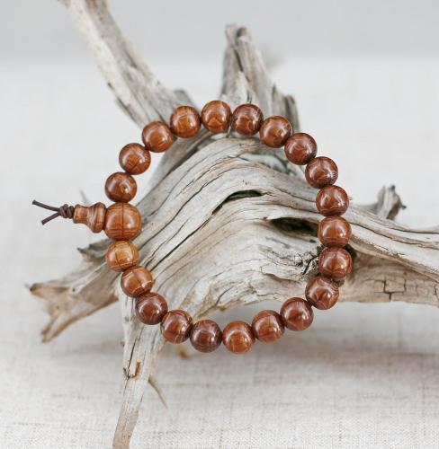Simple mala traditionnel de poignet: perles de bois d'Abélie de couleur soutenue, perle de tête et petit cône de juste simplicité.
